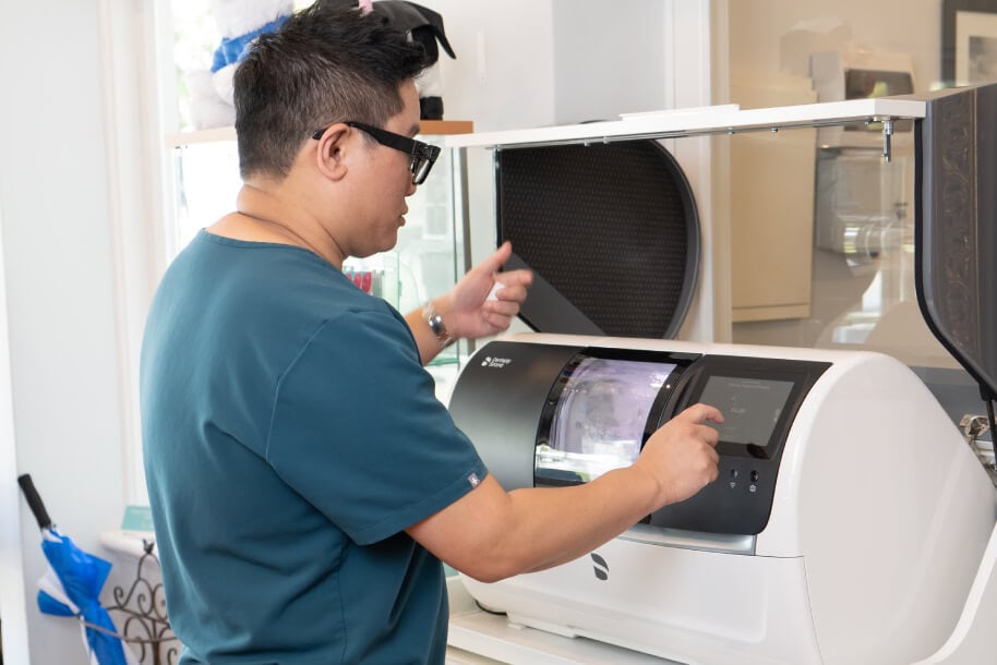 Dentist checking dental item fit and function